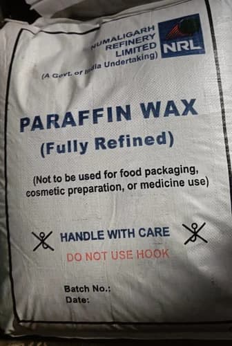 Paraffin Wax — Granular form, clear to white appearance.
