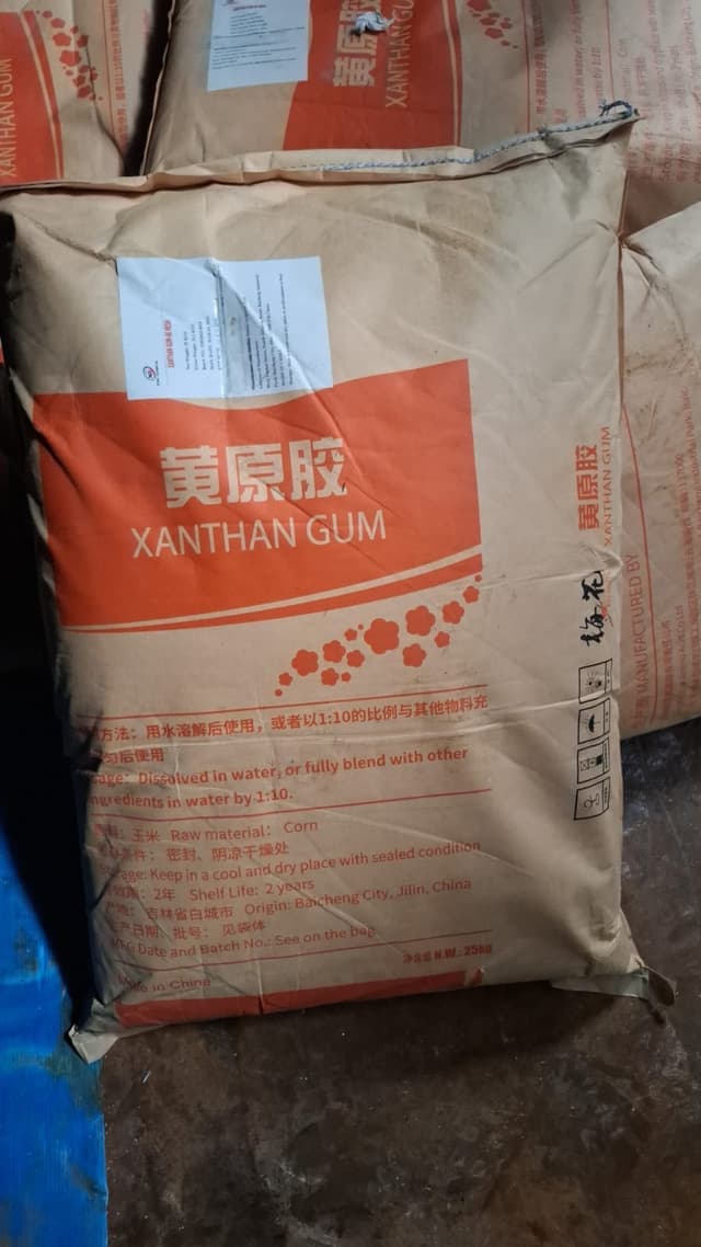 Xanthan Gum — White to off-white powder